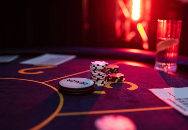 Live casino dealer at multi-camera studio table